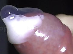 Uncut Cock cumming fluid Sperm in Condom Close-up and Slomo