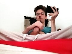 Twink Jerks Off His Big Cock And Ejaculates While Watching A Porno
