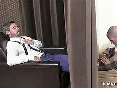 gorgeous businessman has his soles tongued and worshiped